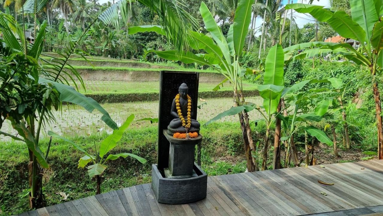 The Sebali Resort Ubud Zewnętrze zdjęcie A statue of the Buddha with a mala
